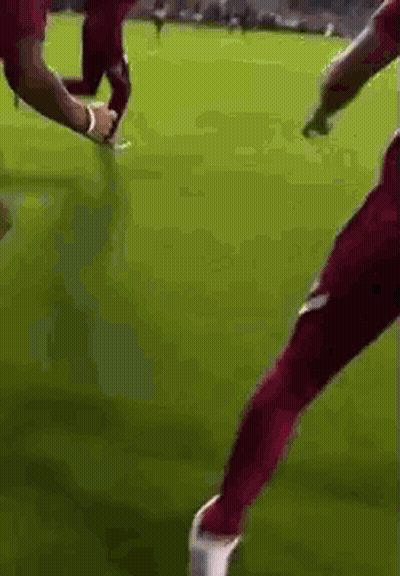Soccer Player In Red Pants Kicking Soccer Ball GIF