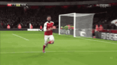 Soccer Player In Red Running Toward Goal GIF