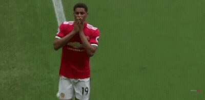 Soccer Player In Red Shirt And White Shorts GIF