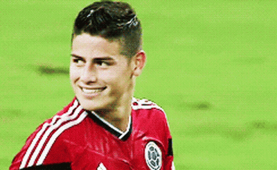 Soccer Player In Red Shirt Scratching Head On Field GIF
