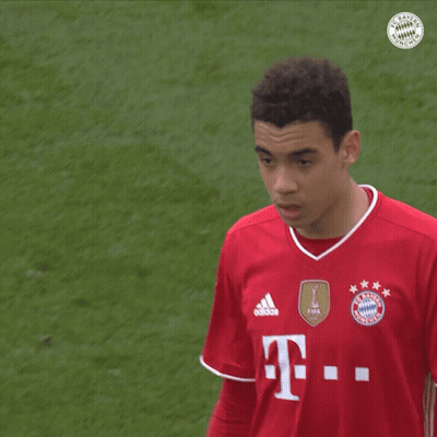 Soccer Player In Red Shirt With Letter T GIF