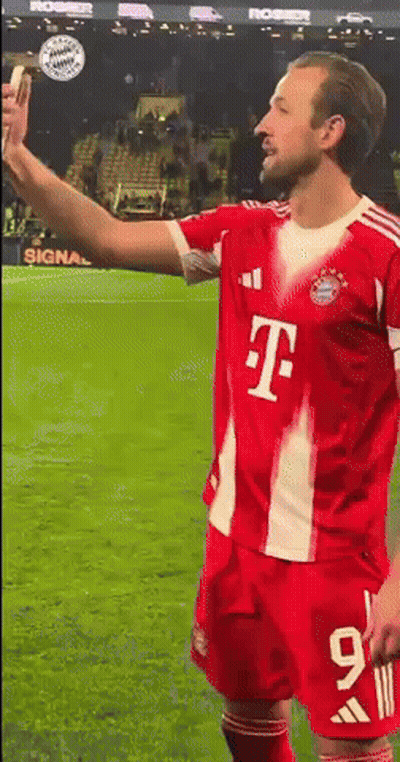 Soccer Player In Red T-Mobile Jersey Taking Selfie GIF