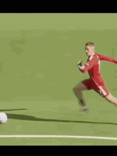 Soccer Player In Red Uniform Kicking Ball GIF