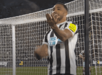 Soccer Player In Striped Jersey With Captain Armband GIF