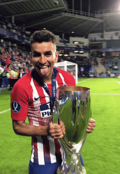 Soccer Player In 'T PU' Shirt Holding Trophy GIF