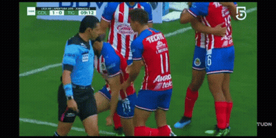 Soccer Player In Tecate Jersey Being Helped Off Field GIF