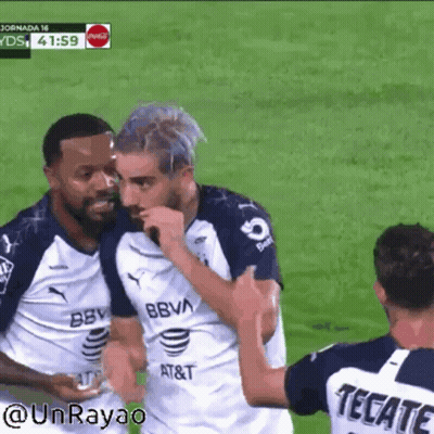Soccer Player In Tecate Jersey Hugging Another Player GIF