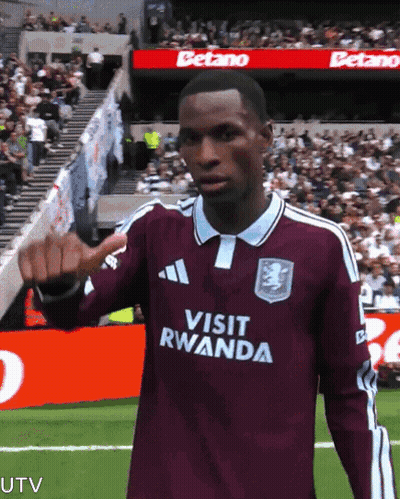 Soccer Player in Visit Rwanda Jersey Thumbs Up