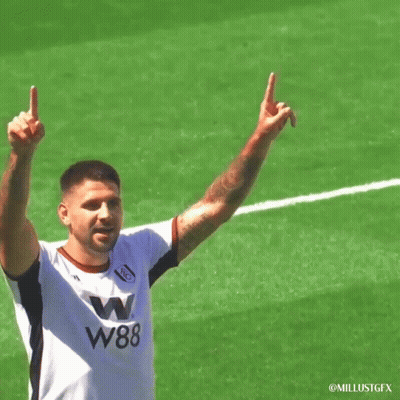 Soccer Player In W88 Jersey Holding Up Arms GIF