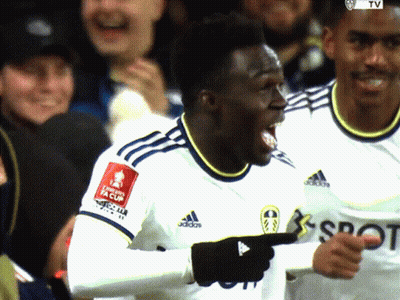 Soccer Player in White Adidas Jersey Pointing at Camera
