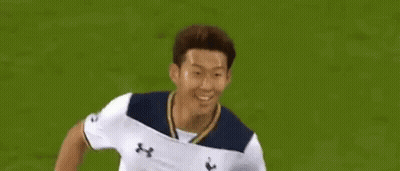 Soccer Player In White AIA Jersey Running GIF
