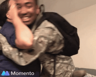 Soccer Player In White And Blue High Fives Another GIF