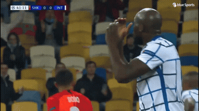 Soccer Player In White And Blue High Fiving Another GIF