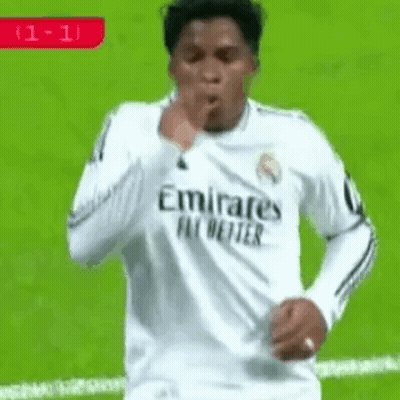 Soccer Player In White Emirates Fly Better Jersey Blowing Kiss GIF