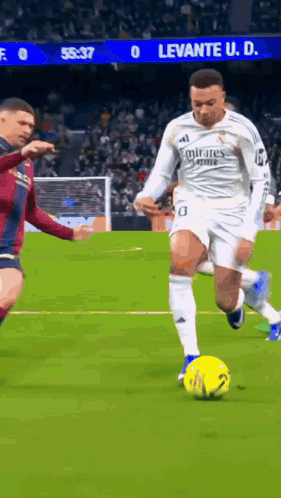 Soccer Player In White Emirates Jersey Kicking Yellow Ball GIF