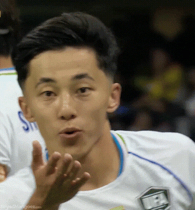 Soccer Player In White Jersey With Green Shield GIF