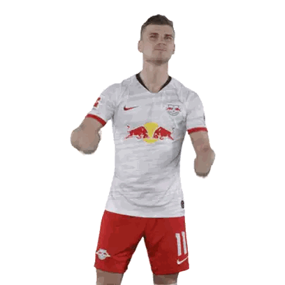 Soccer Player In White Jersey With Red Bull Sticker