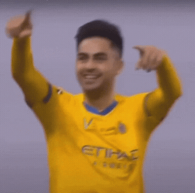 Soccer Player In Yellow And Blue Jersey Smiling GIF