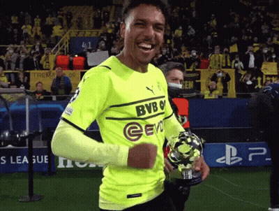 Soccer Player In Yellow BVB Jersey Holding Trophy GIF