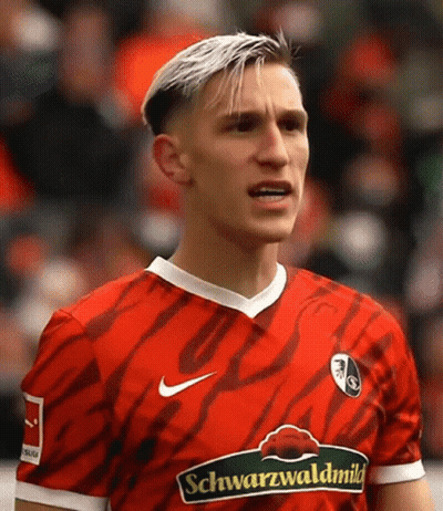 Soccer Player In Yellow Evonik Jersey GIF