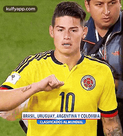 Soccer Player In Yellow Jersey Number 10 Walking On Field GIF