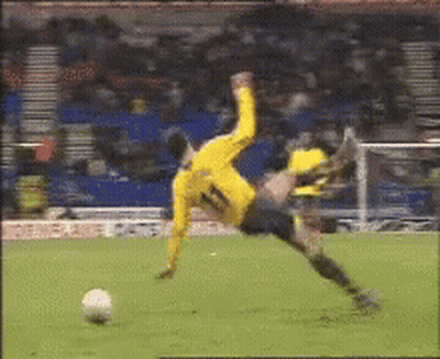 Soccer Player In Yellow Jersey Number 11 Falling GIF