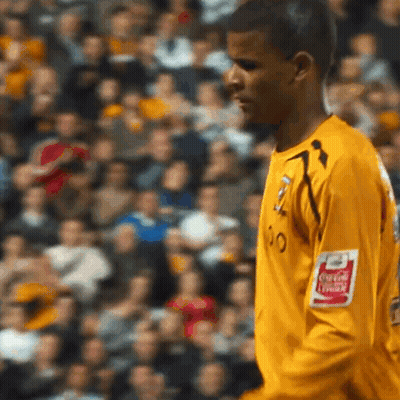 Soccer Player In Yellow Jersey With Coca-Cola Logo On Arm GIF