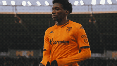 Soccer Player In Yellow Jersey With Land On Sleeve GIF