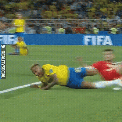Soccer Player In Yellow Lying On Field GIF