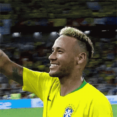 Soccer Player In Yellow Shirt Waving Smile GIF