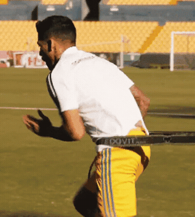Soccer Player In Yellow Shorts And White Shirt GIF