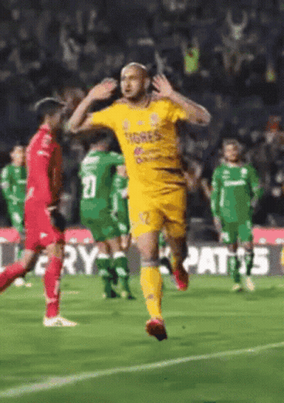 Soccer Player in Yellow Tigres Shirt