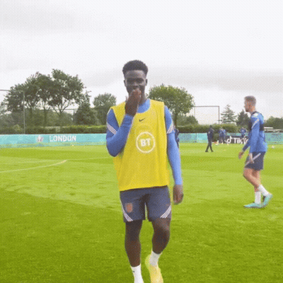 Soccer Player In Yellow Vest And Blue Shorts GIF