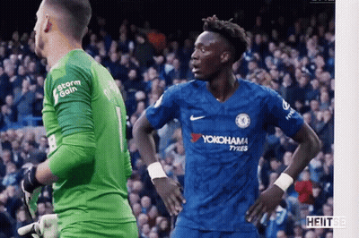 Soccer Player In Yokohama Jersey In Front Of Goalie GIF