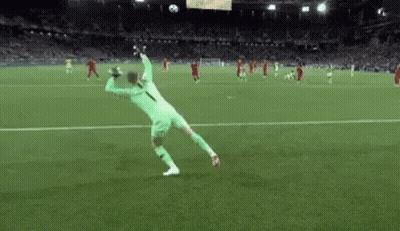 Soccer Player Jumping To Catch Soccer Ball GIF