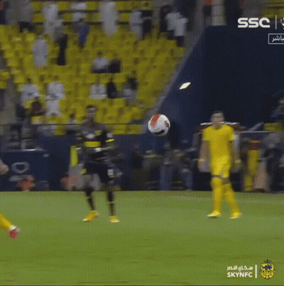 Soccer Player Kicking A Ball In Front Of A Sign That Says Ssc GIF