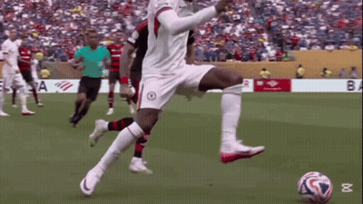 Soccer Player Kicking Ball By Banner Saying Ba GIF