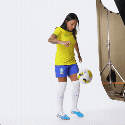 Soccer Player Kicking Ball In Blue Shorts GIF
