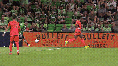 Soccer Player Kicking Ball In Front Of Bulleit Frontier Whiskey Banner GIF