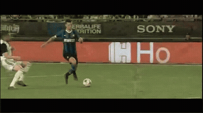 Soccer Player Kicking Ball In Front Of Sony Sign GIF
