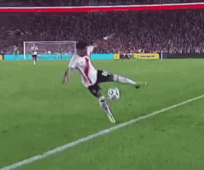 Soccer Player Kicking Ball On Field GIF
