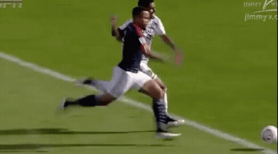 Soccer Player Kicking Ball Opponent Trying To Stop GIF