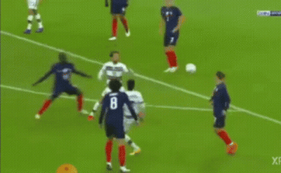 Soccer Player Kicking Ball Towards Goal With Goalkeeper
