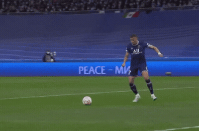 Soccer Player Kicks Ball At Peace Sign GIF