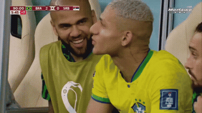 Soccer Player Kissing Teammate On Cheek GIF