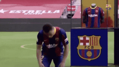 Soccer Player Kneeling In Front Of FCB Sign GIF