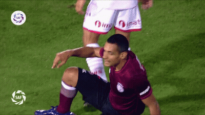 Soccer Player Kneeling In Maroon Shirt GIF