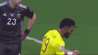 Soccer Player Kneeling In Yellow Jersey Number 19 GIF