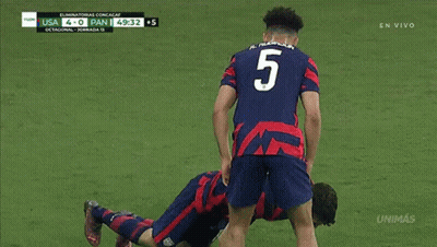 Soccer Player Laying On Ground Against Pan GIF