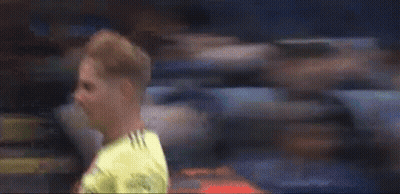 Soccer Player Laying On Ground In Front Of Crowd GIF